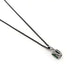 Side view of emerald cut green tourmaline pendant in white gold on a black chain