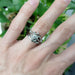 White gold lab diamond engagement ring stacked with multiple bands on a hand