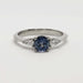 Front view of 14kt white gold ring with blue Montana sapphire and pear cut lab diamonds