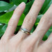 White gold rose cut diamond engagement ring stacked with yellow gold band on hand