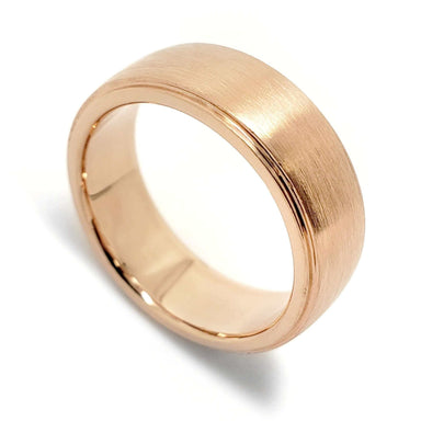 Wide 14kt rose gold wedding band with brushed finish and lowered edges