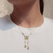 Model wearing an Edwardian 14kt gold negligee necklace with peridot and pearls