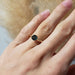 Yellow gold Montana sapphire engagement ring worn on hand