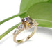 Bi-colour sapphire and lab diamond ring in yellow gold, shown with green leaf background