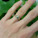 14kt yellow gold ring with diamond and sapphires shown on a hand