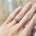 Oval lab diamond yellow gold engagement ring shown on hand