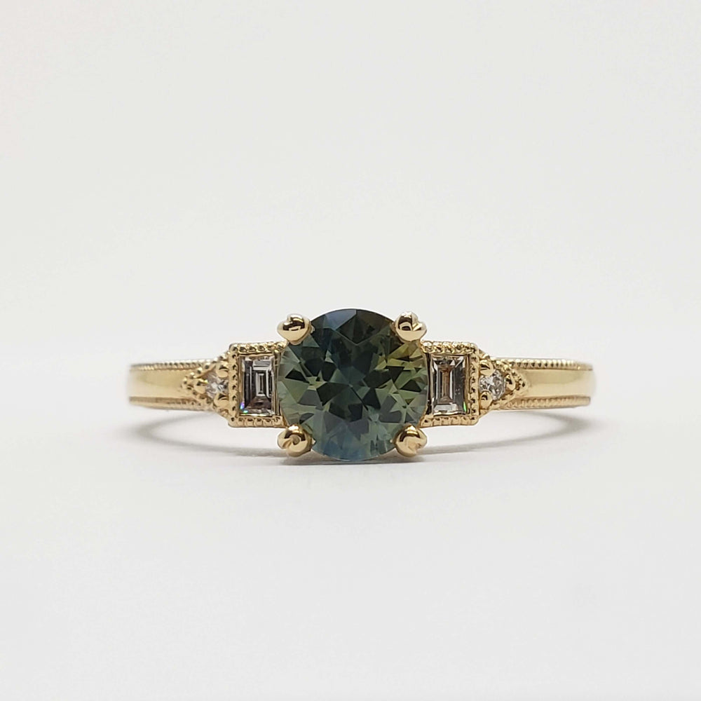 Front view of 14kt yellow gold ring with round Australian sapphire and lab diamond accents