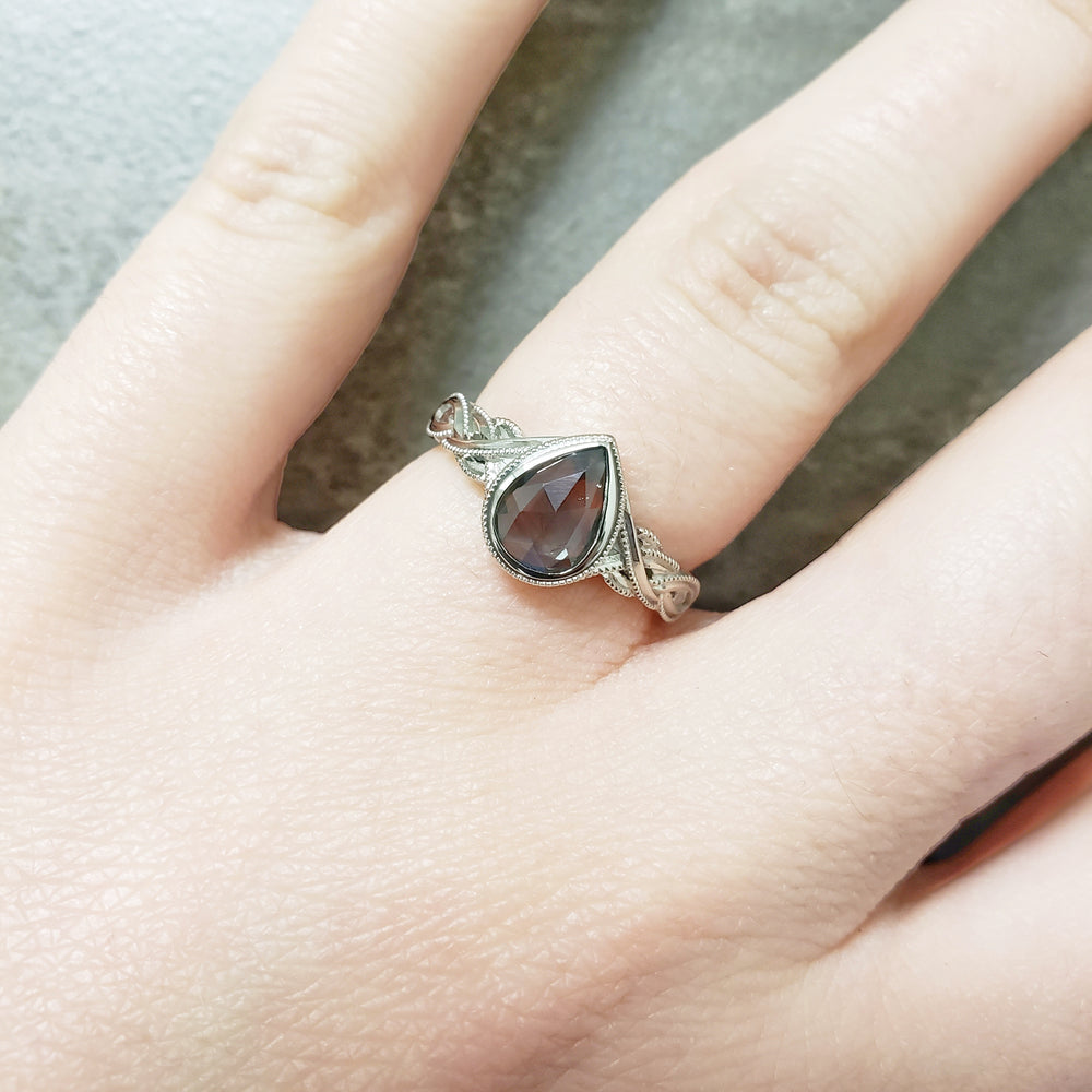 14kt white gold Zarina celtic interlace woven pear shaped rose cut green sapphire millgrain engagement ring era design vancouver